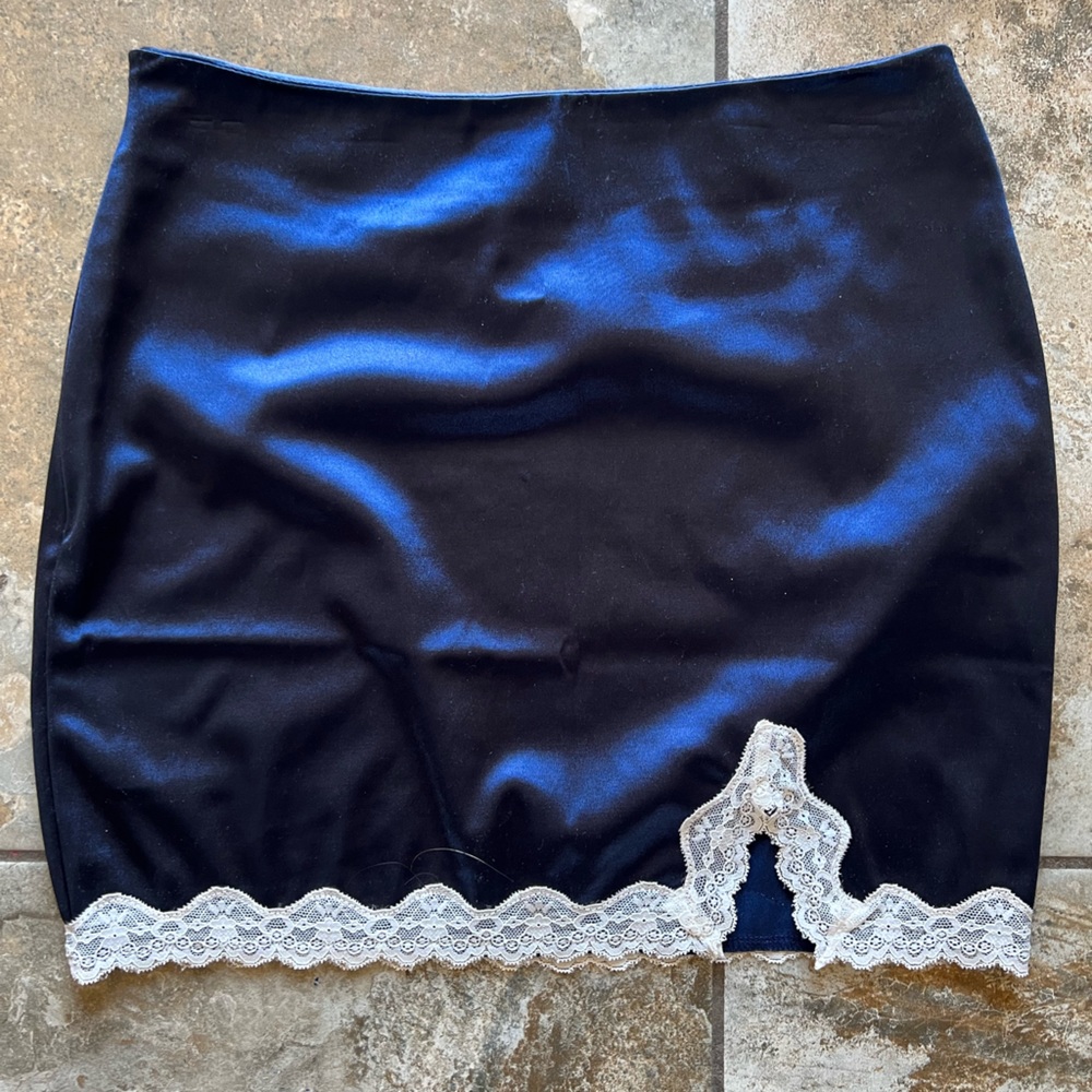 NWOT Blue satin skirt with stretch, white lace edge detail medium